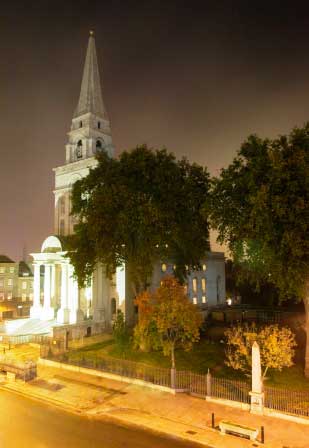 A highlight of our Jack the Ripper guided tour is the soaring white spire of Christchurch Spitalfields seen here by night.