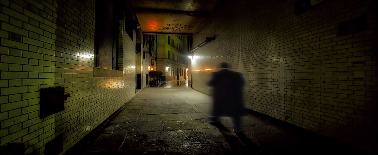 A victorian alleyway by night.